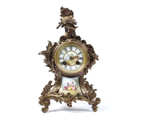 A French mantel clock, the painted porcelain dial on a brass, eight day movement striking to a bell, the gilt metal rococo st