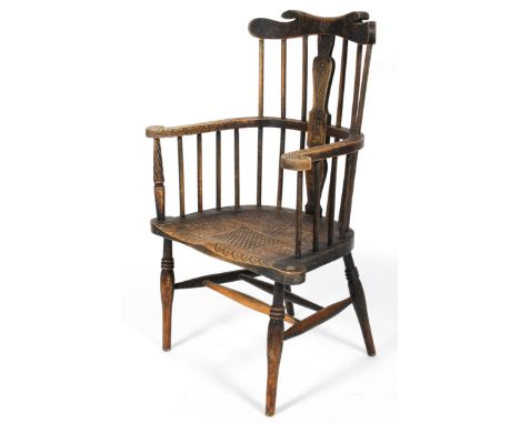 A Folk Art country armchair, the comb back with carved decoration, scrolled arms, solid seat and H stretcher, 107cm high