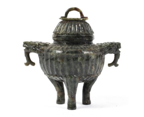 A Chinese spinach 'jade' censer and cover, or archaistic tripod form, carved with bearded beast handles, fluted body and flow