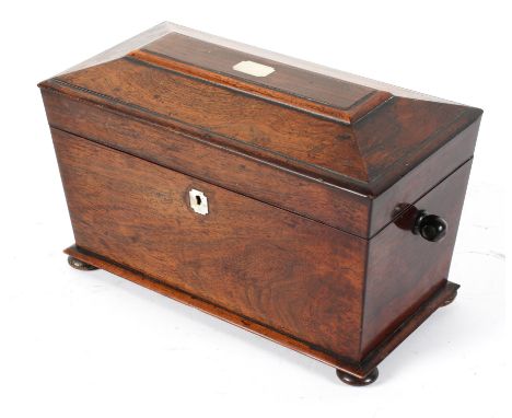 A 19th century rosewood tea caddy, of sarcophagus form, with twin canister interior, 20cm high x 35cm wide x 18cm deep