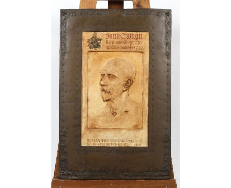 A commemorative plaster and copper plaque, cast with a stained plaster portrait of John Clough, with religious verse, 69.5 cm