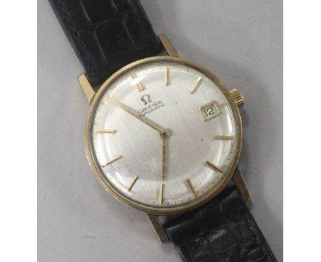 A gentlemen's 1960's 9ct gold Omega automatic wrist watch with date aperture, movement c.562.