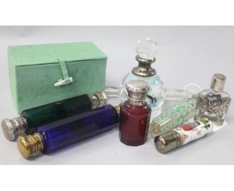 A collection of eight scent bottles, variously-mounted including a 19th century lachrymatory flask (a.f), two double-ended fl