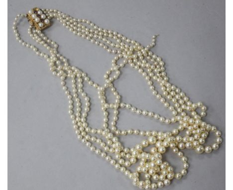 A five strand graduated cultured pearl necklace with 9ct gold, ruby and cultured pearl set clasp, (one stone missing and two 