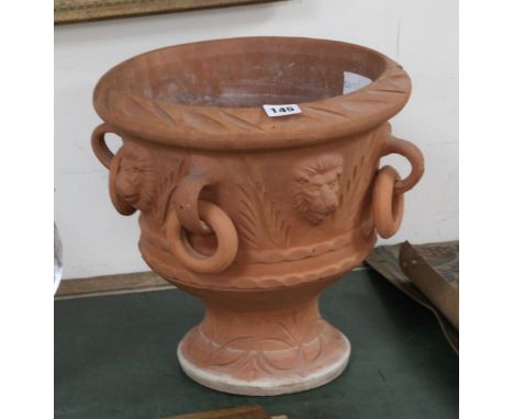 A terracotta urn shaped planter