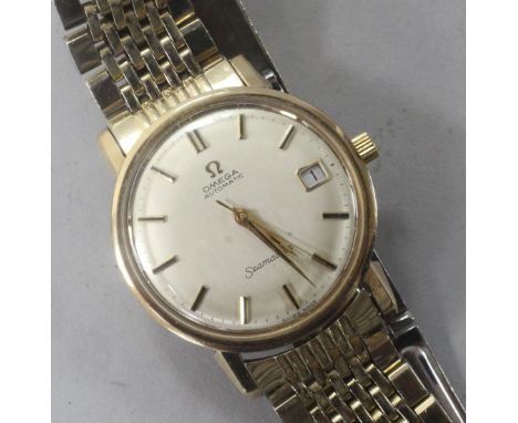 A gentlemen's 1960's 9ct gold Omega automatic Seamaster wrist watch, on gold plated Omega bracelet, movement c.565.