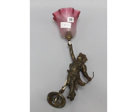 A cherub hanging lamp with cranberry shade