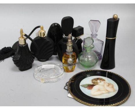 A collection of modern eau de parfum bottles, scent bottles and atomisers, some in Art Deco style, including an engraved soda