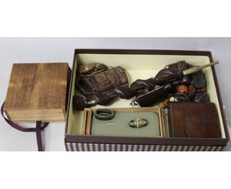 A group of inros and netsuke and two Japanese sword fittings