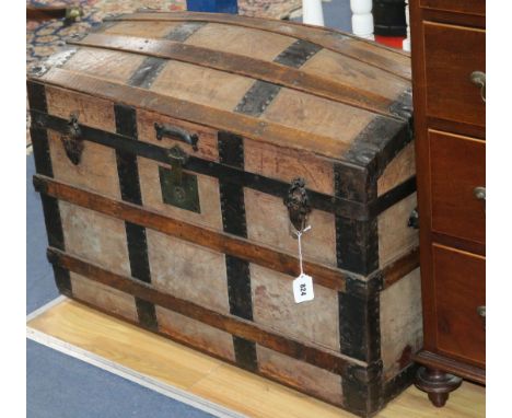 A leather and oak dome top trunk, W.88cm