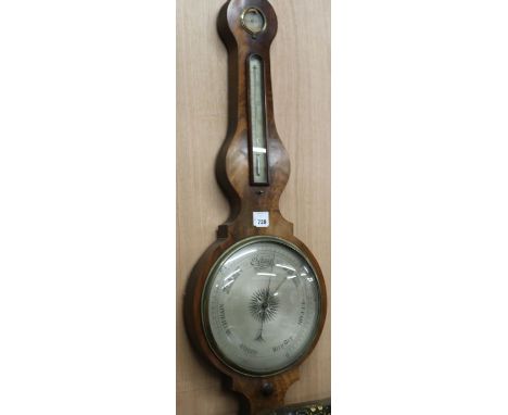 A 19th century mahogany onion topped wheel barometer, thermometer and hygrometer, the level signed Thomas Agnew H.110cm