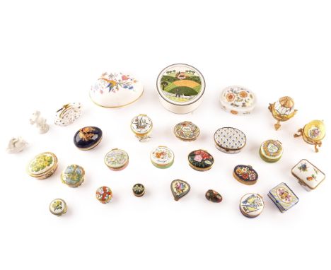 A collection of enamel pill boxes of varying shapes and sizes, including maker's such as Halcyon Days Enamels, Crummles &amp;