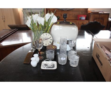 A quantity of glass and china to include drinking glasses; pottery table lamp; artificial flowers; wall clock etc. 