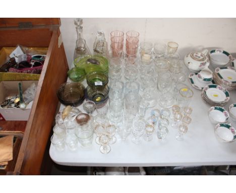 A quantity of drinking glasses; Sundae dishes; decanters; decanter labels etc