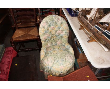 A floral upholstered button back nursing chair