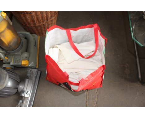 A bag containing John Lewis curtains 