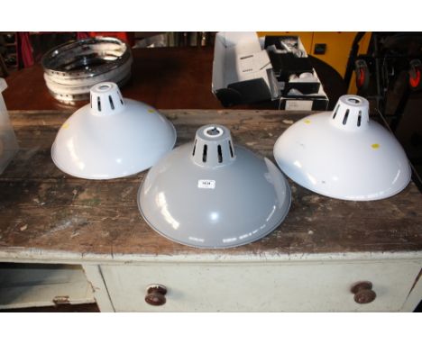 Three industrial light fittings 