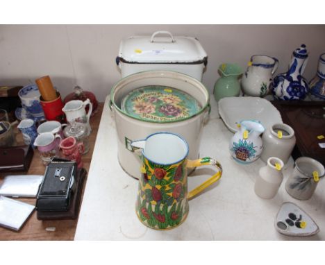 An enamel bread bin; one other enamel bread bin lacking lid etc.