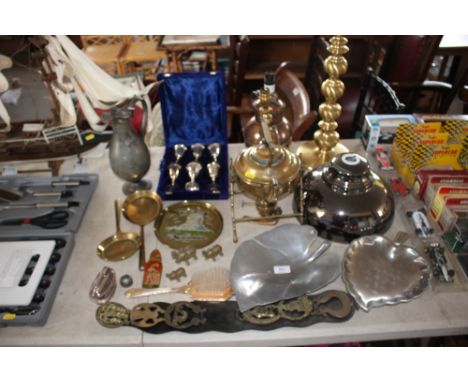 A quantity of metal items to include a cased set of goblets; pewter jug; table lamp bases; horse brasses etc