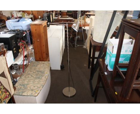 A metal floor standing reading lamp 
