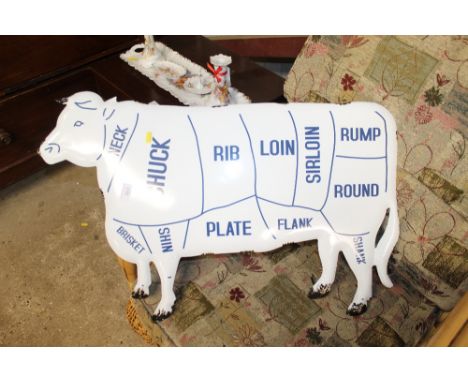 An enamel cow sign