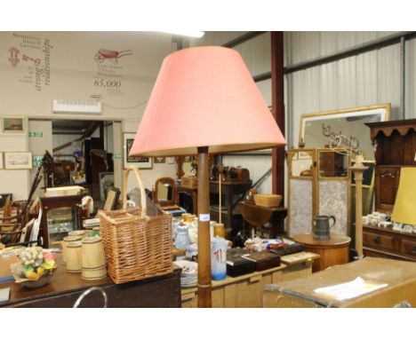 A mahogany turned standard lamp and shade 