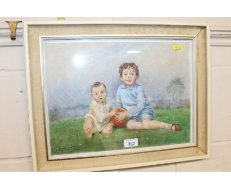 A framed oil portrait depicting two children, indistinctly signed to bottom left