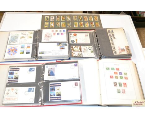 A box of various stamps and First Day covers 