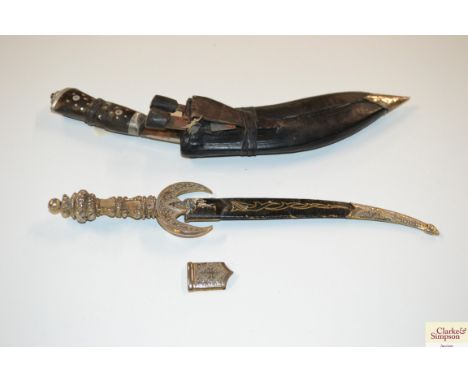 A Kukri; and an eastern curved dagger