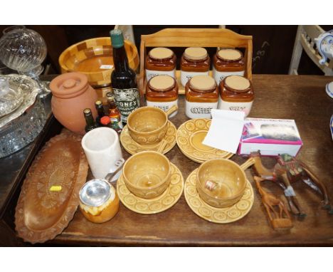 A quantity of vintage storage jars; a turned wooden pedestal bowl; a quantity of Tams cups and saucers; a wooden camel etc. 