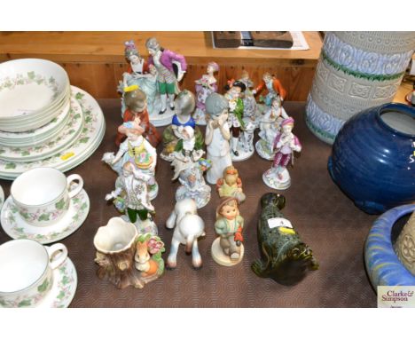 A collection of various porcelain figures including Goebel and Dresden style examples