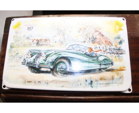 A modern enamel plaque depicting a Jaguar XK20