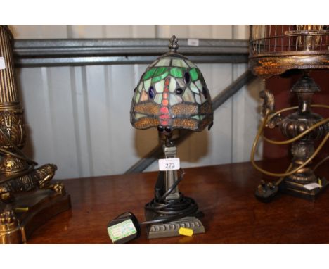 A Tiffany style table lamp and shade with dragonfly decoration