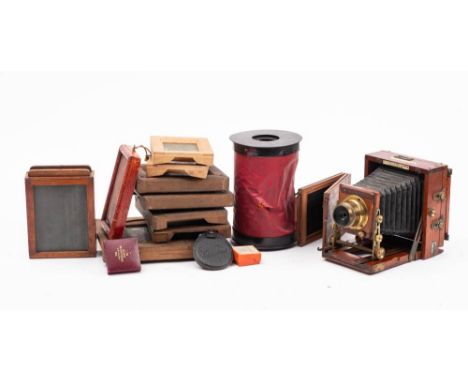 A mahogany and brass 'The Instantograph' quarter plate camera by J Lancaster & Son, Birmingham: with black bellows, together 