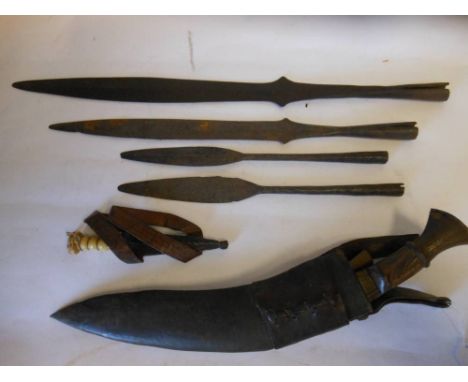 Four Naga Hills spearheads together with a kukri contained in a leather scabbard and a bone handled dagger.