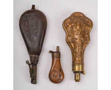 A copper and brass pistol powder flask, unsigned: together with a copper and brass powder flask and a leather shot flask (3) 