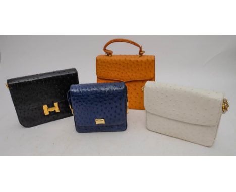 A light tan ostrich skin handbag by Amber, together with a white ostrich skin evening bag by Fiorenza and two blue others by 
