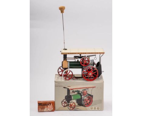 Mamod. A boxed live steam  TE1a Steam Tractor: white canopy, green boiler, red spoked wheels, (appears unused, some oxidisati