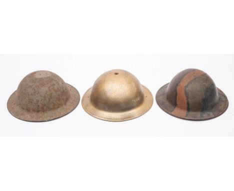 Two WWII period Mk I steel helmets and a MK III steel helmet by Briggs Motor Bodies: (3) (no liners)  