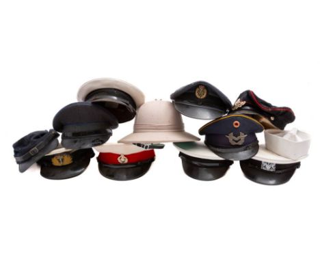 A collection of various peaked caps, including RAF and RN, also a modern Pith helmet ( a lot) 