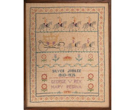 A framed 1933 Silver Jubilee silkwork tapestry with banded decoration of Horseguards, Royal coach, crowns, flowers and script