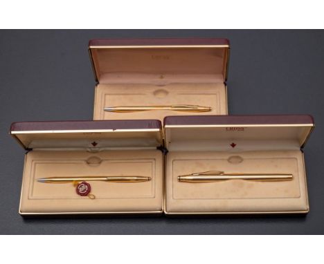 A Cross 2805 gold plated roller ball pen and two 2802 gold plated ball pens, cased (3) 