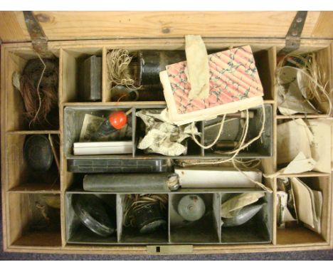A collection of late 19th century fishing equipment in a pine box, including a leather fly wallet with manuscript inscription