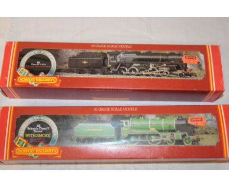 A Hornby OO gauge R294 BR class 2-10-0 locomotive and tender in original box and R380 Schools class "Stowe" locomotive and te