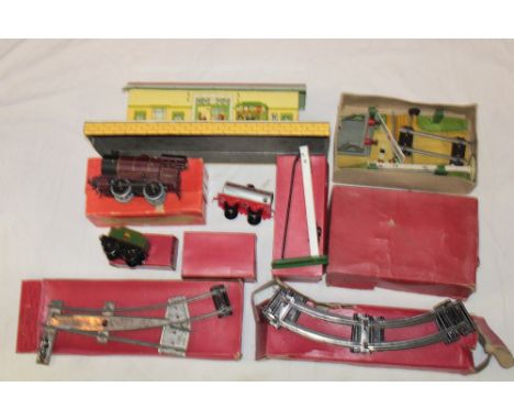 Hornby O Gauge - a clockwork reversing tank locomotive, boxed No. 1 level crossing, tin plate booking office, boxed track etc