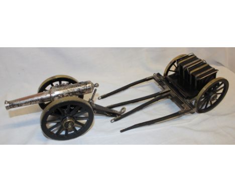 A good quality silver plated and brass mounted model field gun with 7" barrel together with limber and attachments