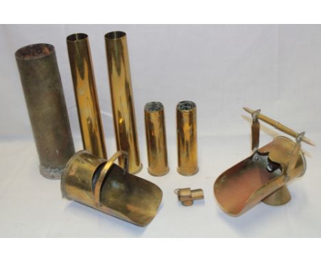 A trench-art brass shell case scuttle with bullet handle, one other trench-art scuttle dated 1910 and five other various bras