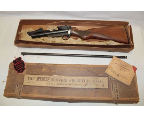 A Webley .22 service air rifle No S12711 with detachable barrel in original box with instructions and ticket 