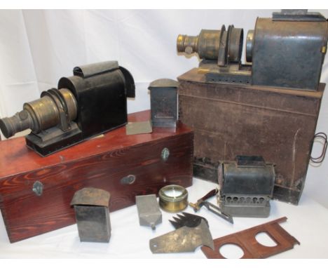 A Victorian brass mounted painted metal magic lantern slide projector with oil fitment and accessories in fitted metal case t