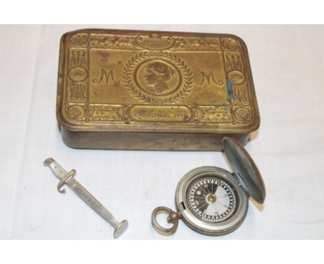 An original 1914 Christmas gift tin, First War 1915 Officer's pocket compass by L Kamm & Co London and an Ypres bayonet desk 